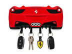 Red Ferrari 458 style wall key hanger with four hooks, round taillights and triple exhaust. Keys shown for display.